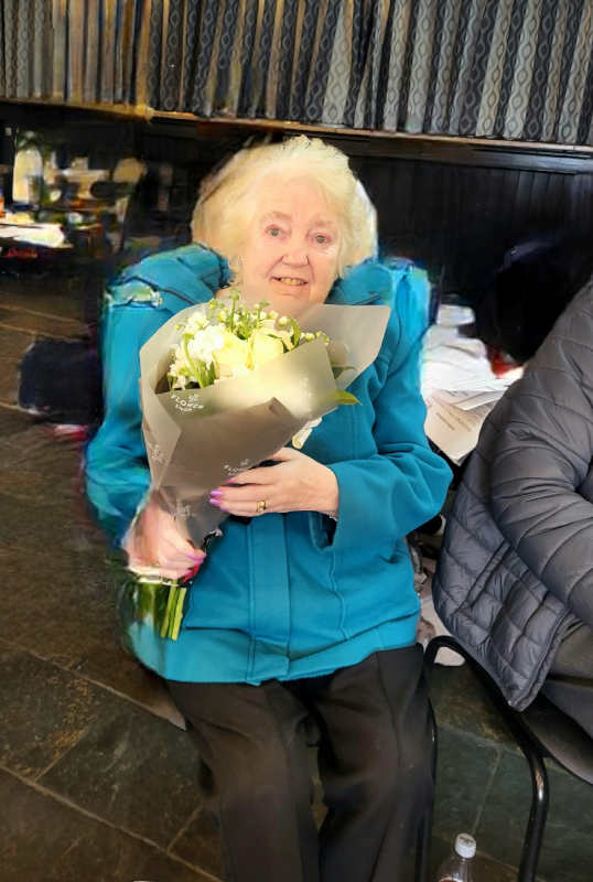 June being presented with flowers at our 2023 AGM